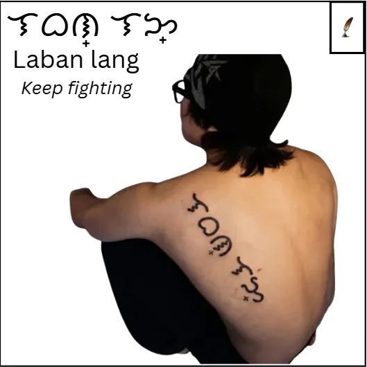Baybayin tattoo of the word “laban lang”, meaning "keep fighting", displayed on back as an short quote or phrase Filipino script design